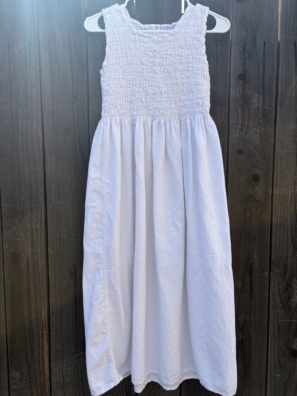 white sleeveless smocked midi dress. No tags
